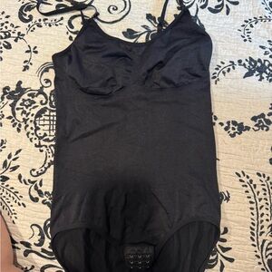 Elegant Black Women's Bodysuit
Brand new no tags.